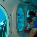 07-enjoy-attraction-feeding-fish-at-odyssey-submarine-bali